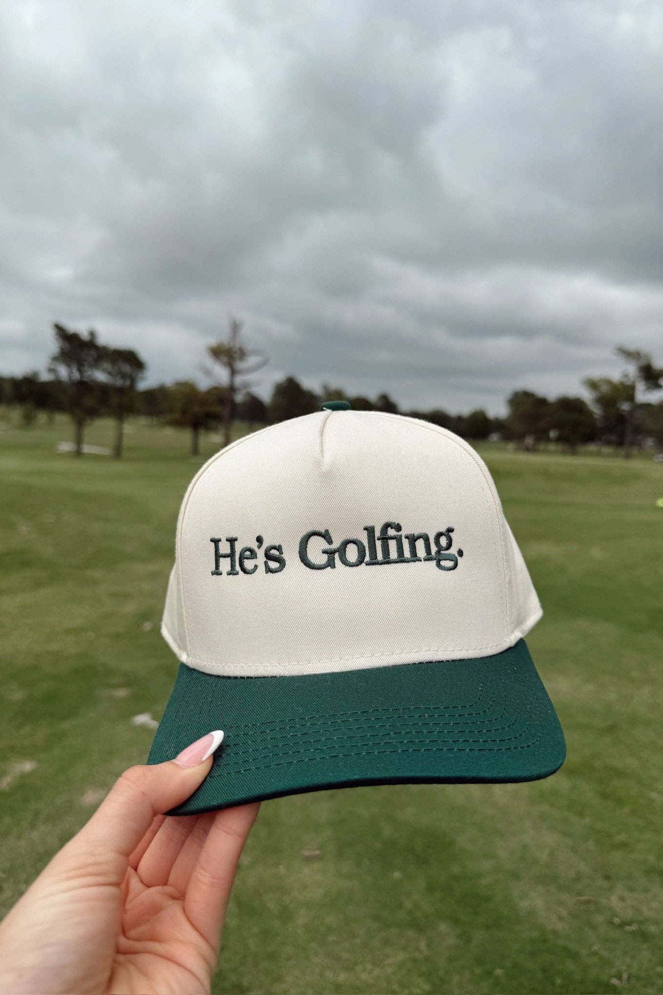 He's Golfing - Green Vintage Trucker Hat