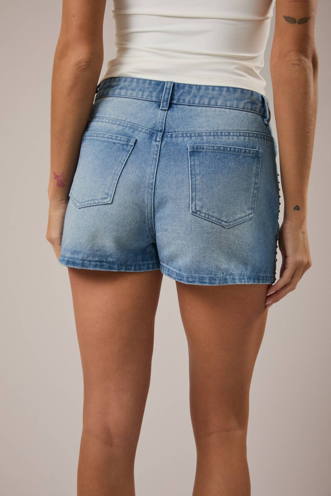 Just the Thing Light Wash Denim Mini Skirt with Studded Detail