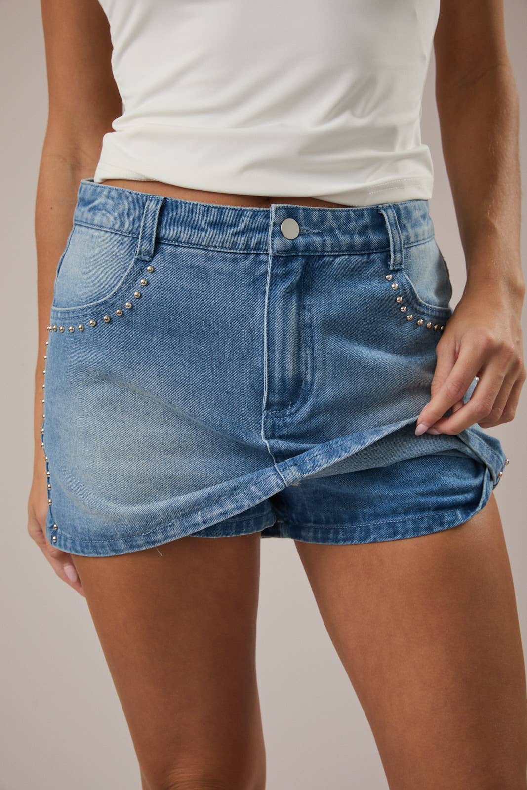 Just the Thing Light Wash Denim Mini Skirt with Studded Detail